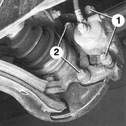 Направляющие пальцы (1) тормозных колодок и болты (2) крепления направляющей тормозных колодок к поворотному кулаку